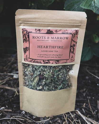 Tea package labeled 'Hearthfire' by Roots & Marrow on a natural background